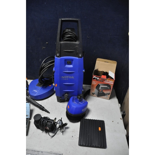 1069 - A NILFISK C1110.3 PRESSURE WASHER with a selection of attachments, along with a Pro user battery cha... 