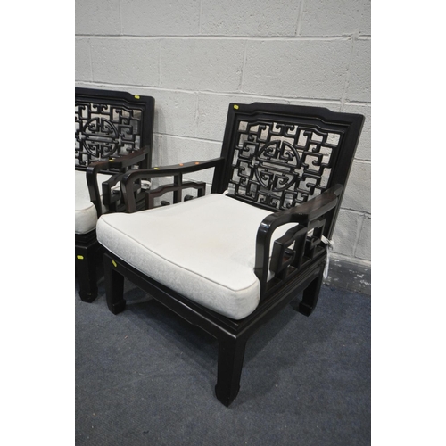 1210 - A PAIR OF ORIENTAL HARDWOOD ARMCHAIRS, with a cushion, width 67cm x depth 69cm x 82cm (2)