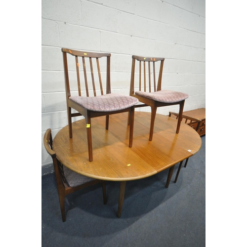 1213 - A MID CENTURY TEAK CIRCULAR EXTENDING DINING TABLE, with a single fold out leaf, extended length 169... 