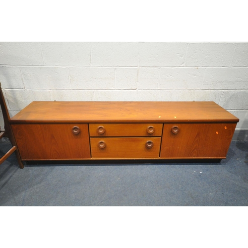 1213 - A MID CENTURY TEAK CIRCULAR EXTENDING DINING TABLE, with a single fold out leaf, extended length 169... 