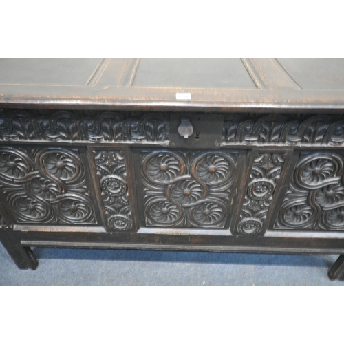 1230 - A GEORGIAN OAK COFFER, with paneled hinged lid, front with carved panels, length 135cm x depth 57cm ... 