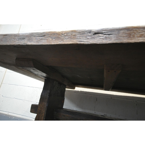 1236 - A RECLAIMED WOOD RUSTIC FARMHOUSE TABLE, on trestle legs united by a single stretcher, length 251cm ... 