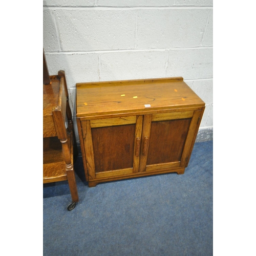 1245 - AN EARLY 20TH CENTURY OAK TWO DOOR CABINET, width 75cm x depth 35cm x height 64cm, an oak tea trolle... 