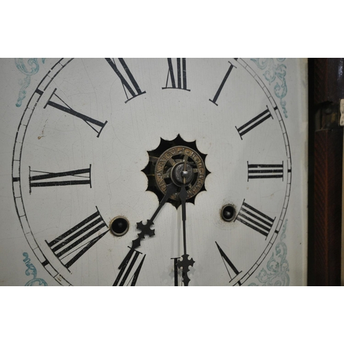 1276 - A VINTAGE FLAME MAHOGANY AMERICAN WALL CLOCK, height 66cm