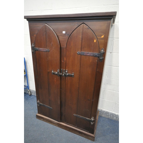 1290 - A GOTHIC STAINED PINE TWO DOOR CUPBOARD, width 115cm x depth 59cm x height 176cm (condition:-both do... 