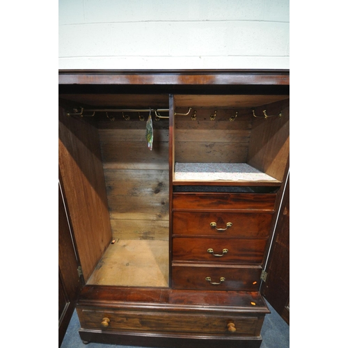 1291 - A VICTORIAN FLAME MAHOGANY TWO DOOR WARDROBE, enclosing a fitted interior, on a single long drawer, ... 