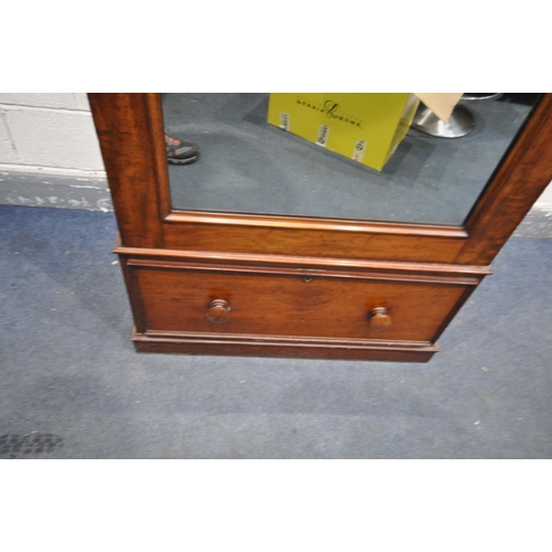 1292 - A VICTORIAN FLAME MAHOGANY SINGLE MIRROR DOOR WARDROBE, enclosing various hooks, over a single drawe... 