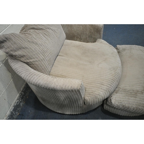 1299 - A BEIGE UPHOLSTERED LARGE REVOLVING CHAIR, with footstool, diameter 130cm x height 72cm (good condit... 