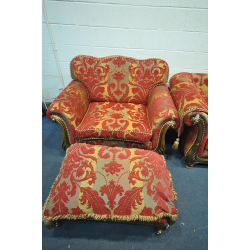 1308 - A RED FLORAL UPHOLSTERED THREE PIECE LOUNGE SUITE, comprising a three seater sofa, a wide armchair, ... 