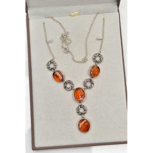 19 - A COPAL AMBER NECKLACE, four oval copal amber stones collet set in a white metal necklet, interspace... 