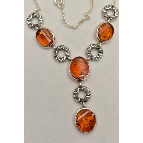 19 - A COPAL AMBER NECKLACE, four oval copal amber stones collet set in a white metal necklet, interspace... 