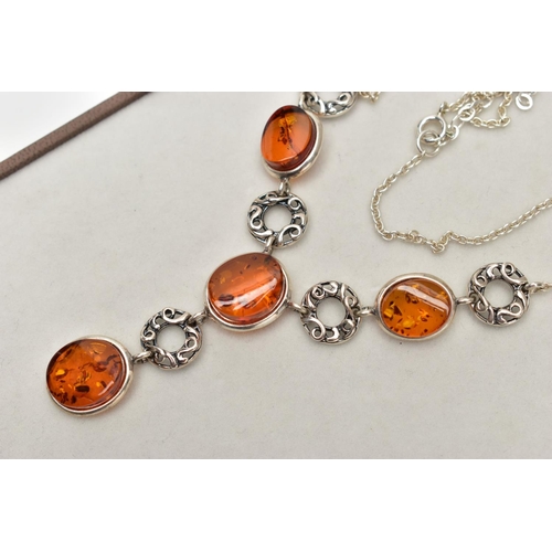 19 - A COPAL AMBER NECKLACE, four oval copal amber stones collet set in a white metal necklet, interspace... 