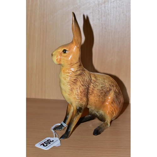 302 - A BESWICK FIGURE OF A SEATED HARE, model no 1025, tan gloss finish, issued 1945-1963, height 18cm, i... 