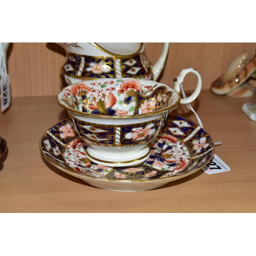 327 - A NINETEENTH CENTURY ENGLISH TEACUP, SAUCER AND CREAM JUG, in an Imari pattern, the teacup having a ... 