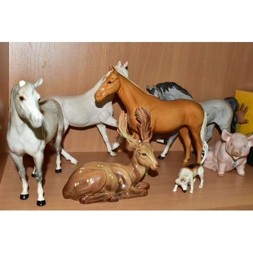 332 - A GROUP OF BESWICK HORSES AND OTHER ANIMALS, comprising a palomino Imperial model no 1557, a grey Ar... 