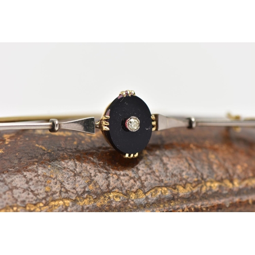 35 - A YELLLOW METAL DIAMOND SET BAR BROOCH, centring on an oval onyx panel set with a single cut diamond... 