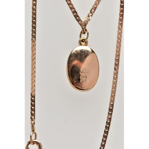 36 - A 9CT GOLD LOCKET PENDANT NECKLACE, the locket of an oval form decorated with an engraved floral pat... 