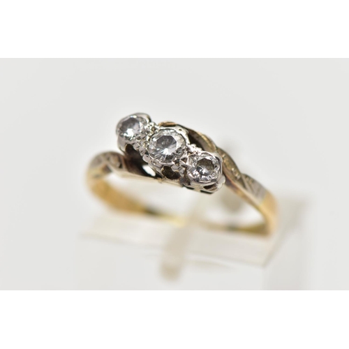 4 - A MID 20TH CENTURY WHITE AND YELLOW METAL DIAMOND THREE STONE RING, set with graduating round brilli... 