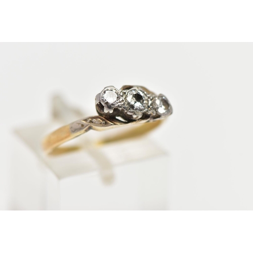 4 - A MID 20TH CENTURY WHITE AND YELLOW METAL DIAMOND THREE STONE RING, set with graduating round brilli... 