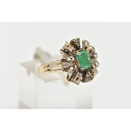 41 - A 1970s EMERALD AND DIAMOND CLUSTER RING, of geometric design, set with a principal rectangular cut ... 