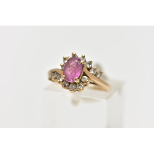 48 - A 9CT GOLD RUBY AND DIAMOND RING, centring on an oval cut ruby, in a four claw setting, with single ... 