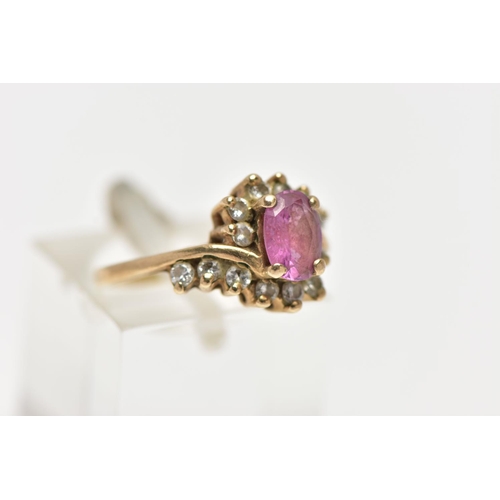 48 - A 9CT GOLD RUBY AND DIAMOND RING, centring on an oval cut ruby, in a four claw setting, with single ... 