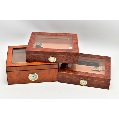 68 - THREE 'GERMANUS' AMBOYNA CIGAR HUMIDOR BOXES, two shallow wooden boxes with an open top glass panel,... 