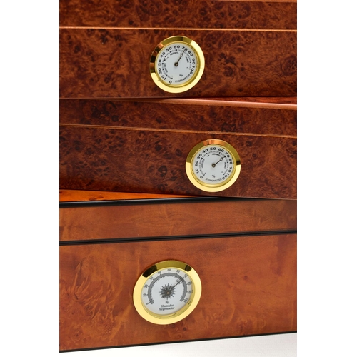 68 - THREE 'GERMANUS' AMBOYNA CIGAR HUMIDOR BOXES, two shallow wooden boxes with an open top glass panel,... 