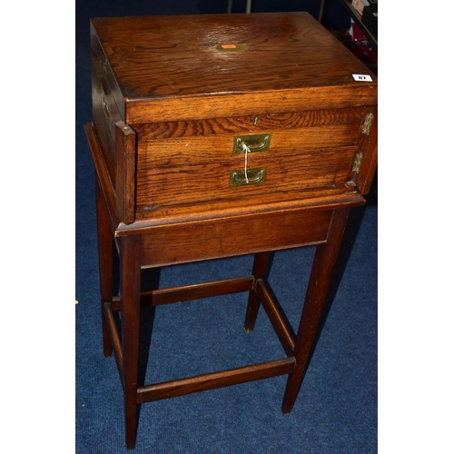 87 - A WOODEN FREE STANDING INCOMPLETE CANTEEN, comprising cutlery with names to include 'Robert F Mosley... 