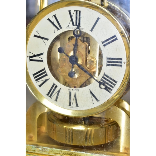 353 - AN ATMOS JAEGER-LECOULTRE  SWISS MADE MANTEL CLOCK, in a rectangular brass and glass case, cream cha... 