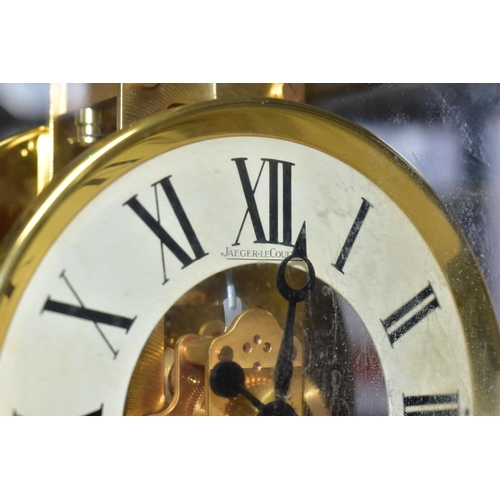 353 - AN ATMOS JAEGER-LECOULTRE  SWISS MADE MANTEL CLOCK, in a rectangular brass and glass case, cream cha... 