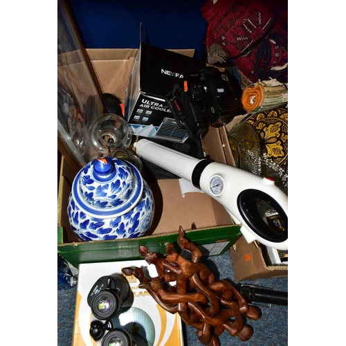 367 - TWO BOXES OF HOUSEHOLD SUNDRIES, to include raffia baskets, small rugs, a Ricoh Mirai zoom camera, a... 