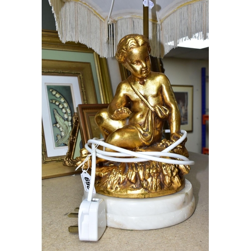 369 - A GROUP OF LAMPS AND GILT FRAMED PRINTS, comprising a small figural standard lamp with cherubs aroun... 