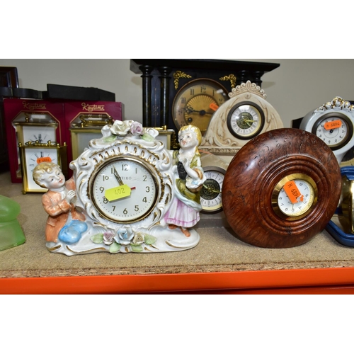 402 - A QUANTITY OF CLOCKS, comprising a Ron Coles native Australian Red Burl wood mantel clock, a wooden ... 