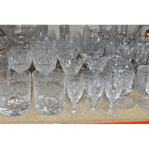 412 - A GROUP OF CUT CRYSTAL AND OTHER GLASS WARES, sixty to seventy pieces to include a cut crystal table... 