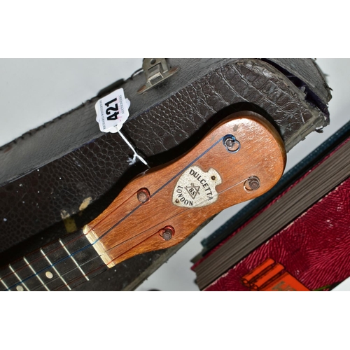 421 - A BARNETT SAMUEL DULCETTA UKULELE BANJO IN DISTRESSED CASE, the banjo has four tuning keys, total ap... 