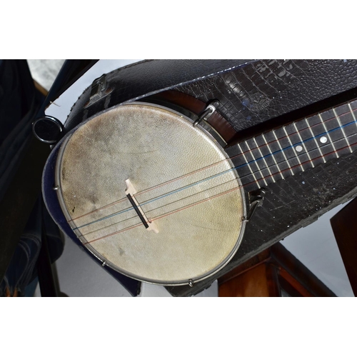 421 - A BARNETT SAMUEL DULCETTA UKULELE BANJO IN DISTRESSED CASE, the banjo has four tuning keys, total ap... 