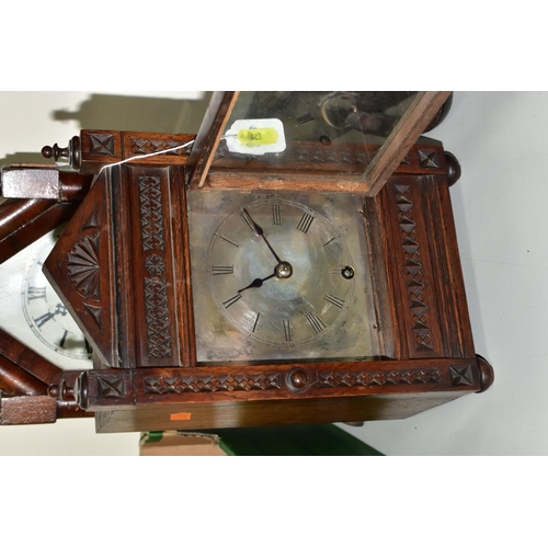 423 - A WINTERHALDER AND HOFMEIER OAK CARVED OAK MANTLE CLOCK, the silvered dial having roman numeral hour... 