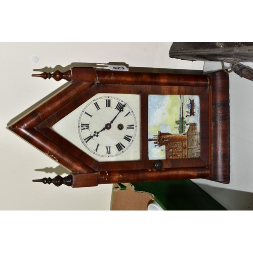 423 - A WINTERHALDER AND HOFMEIER OAK CARVED OAK MANTLE CLOCK, the silvered dial having roman numeral hour... 