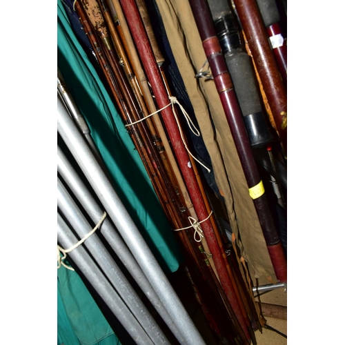 451 - A LARGE QUANTITY OF VINTAGE FISHING RODS AND EQUIPMENT, comprising a 'The East Lancashire Regiment' ... 