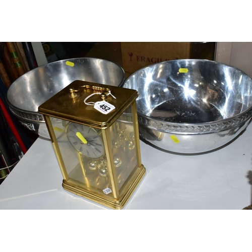 452 - TWO PORTMEIRION ALUMINIUM BOWLS AND A BRASS MANTEL CLOCK, the bowls have the iconic Botanic Garden l... 