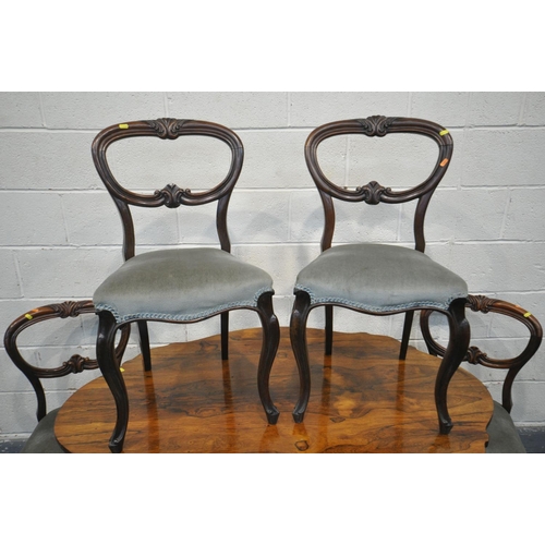 1198 - A VICTORIAN ROSEWOOD BREAKFAST TABLE, with a wavy top, on four scrolled legs and casters, length 137... 