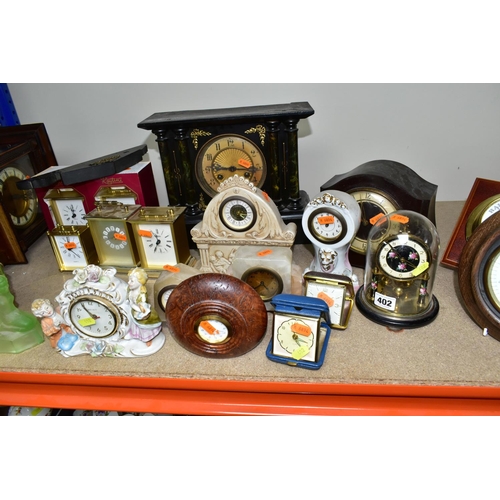 402 - A QUANTITY OF CLOCKS, comprising a Ron Coles native Australian Red Burl wood mantel clock, a wooden ... 