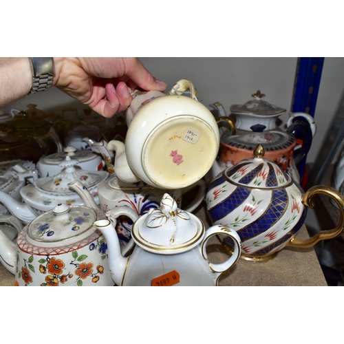 410 - A COLLECTION OF TEAPOTS AND OTHER TEA WARES, to include approximately twenty teapots, a nineteenth c... 