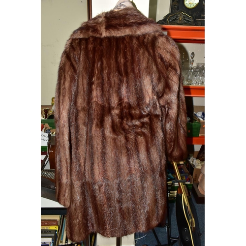 419 - TWO UNBRANDED FURS AND WALKING STICKS ETC, comprising a brown fur coat, a light brown jacket, a faux... 