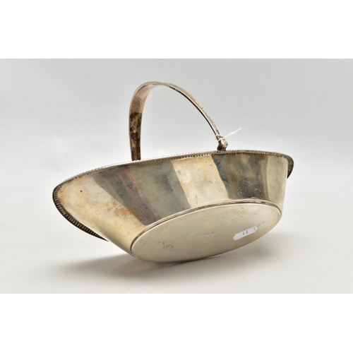 100 - A SILVER BASKET,  a boat shaped dish, engraved with floral detail, fitted with a tapered handle, app... 