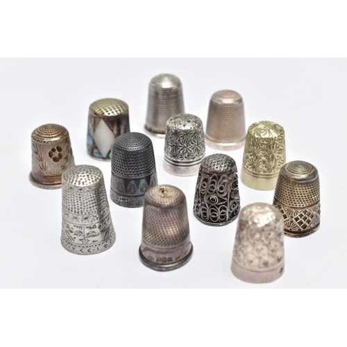 105 - TWELVE THIMBLES, to include six with silver hallmarks, approximate gross weight 27.0 grams, six othe... 