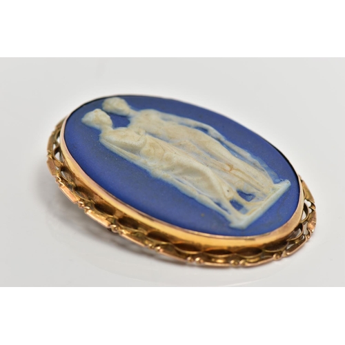 12 - A WEDGWOOD BROOCH, of an oval form, blue and white portrait of two ladies, collet set into a yellow ... 