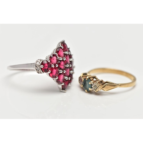 16 - TWO GEM SET RINGS, the first a large marquise shape ring set with sixteen oval cut garnets, each in ... 