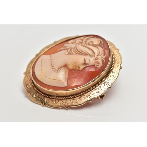 17 - A 9CT GOLD SHELL CAMEO BROOCH/PENDANT, of an oval form depicting a lady in profile, collet set with ... 